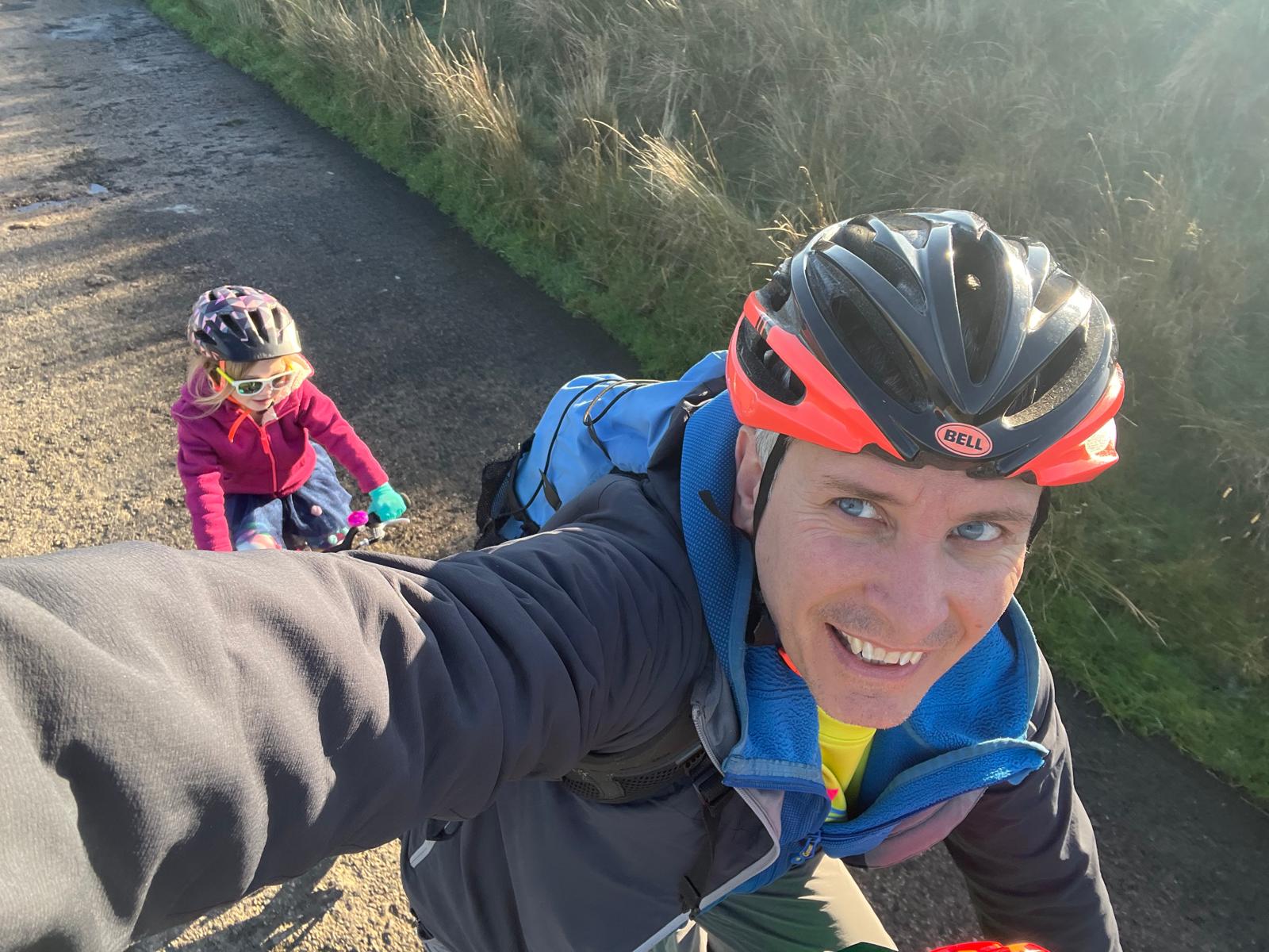 selfie of a dad and daughter using the FollowMe Tandem