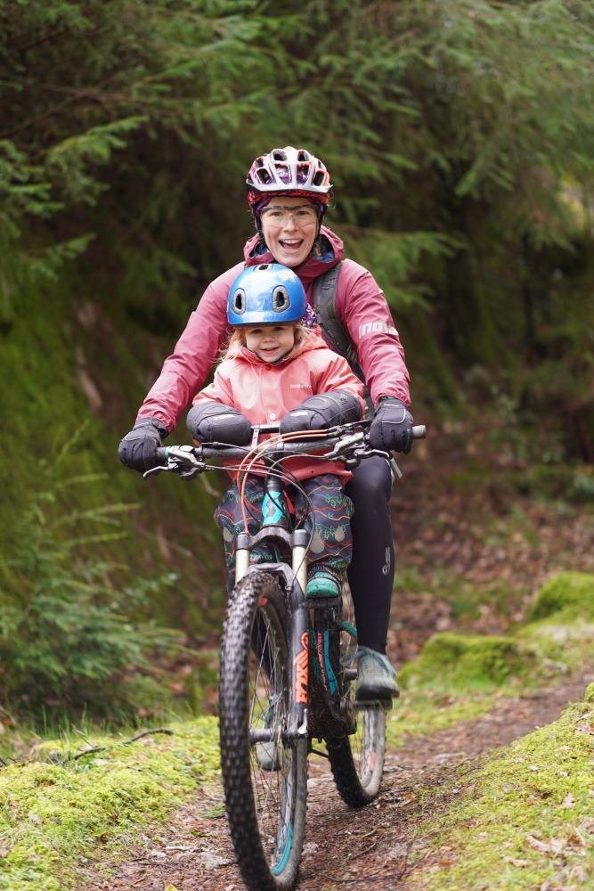 Kids Ride Shotgun seat review, mum and daughter riding on an off road trail in winter