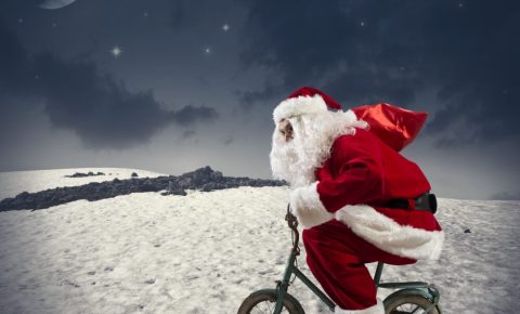 Kids Bike Search - photo of Father Christmas on a small childs bike cycling across the snow