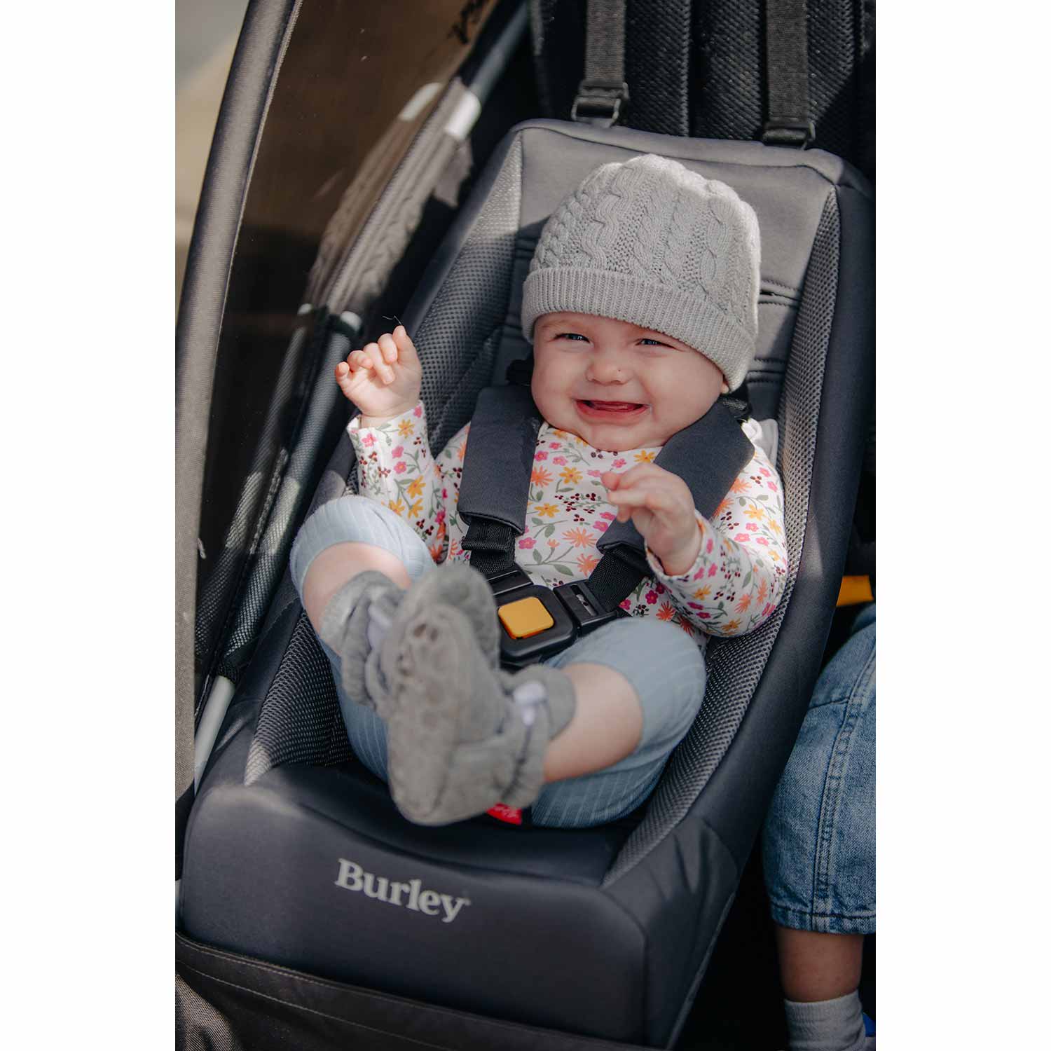 Baby smiling in a Burley Baby Seat Insert