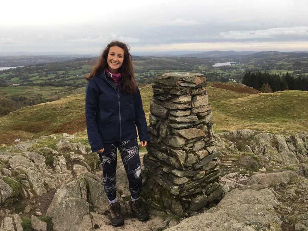 Photo of a woman at the top of a hill