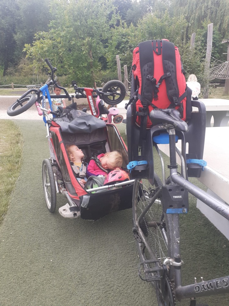 Kidvelo Rookie 12 review: two balance bikes strapped to the back of a trailer on a family cycle tour.